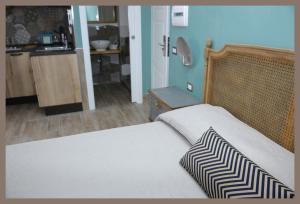 Postel nebo postele na pokoji v ubytování B&b Slow life