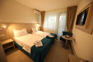 Postel nebo postele na pokoji v ubytování Hotel Delfin