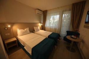 Postel nebo postele na pokoji v ubytování Hotel Delfin