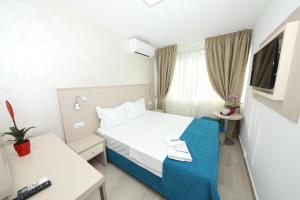 Postel nebo postele na pokoji v ubytování Hotel Delfin
