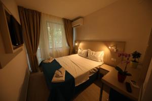 Postel nebo postele na pokoji v ubytování Hotel Delfin