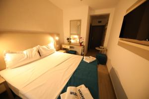 Postel nebo postele na pokoji v ubytování Hotel Delfin