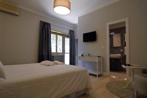 Televízia a/alebo spoločenská miestnosť v ubytovaní B&B Tiburtina Garden