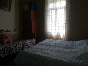 Voodi või voodid majutusasutuse Guest house of Givi toas