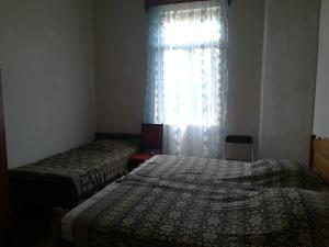 Voodi või voodid majutusasutuse Guest house of Givi toas