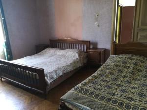 Postel nebo postele na pokoji v ubytování Guest house of Givi