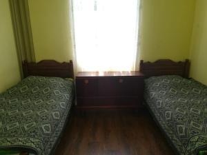 Voodi või voodid majutusasutuse Guest house of Givi toas