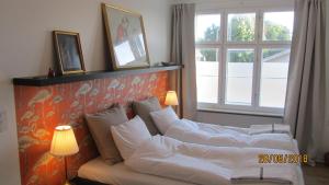 Postel nebo postele na pokoji v ubytování Årslev B&B
