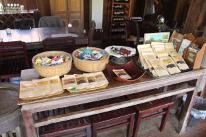 a table with baskets of shoes on top of it at Soriyabori Villas Resort in Kratie