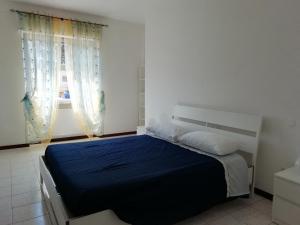 A bed or beds in a room at La Terrazza Apartment