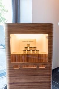 a wooden shelf with a wooden head board at Ku'Damm 101 Hotel in Berlin