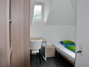Postel nebo postele na pokoji v ubytování August Restaurant Hotel