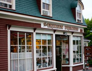 a store with a sign on the front of a building at Eriksen Premises in Trinity