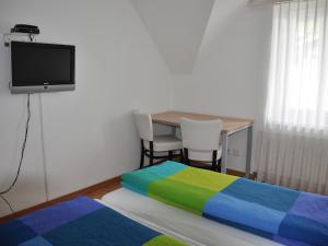 Postel nebo postele na pokoji v ubytování August Restaurant Hotel