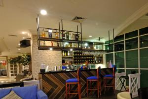 The lounge or bar area at The Bellezza Hotel Suites