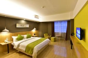 TV a/nebo společenská místnost v ubytování Jihao Selected Hotel