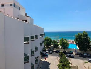 a large white building with a view of the ocean at Mediterranea Hotel & Convention Center in Salerno