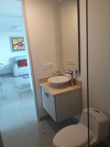 a bathroom with a sink and a toilet at Apartamento seaway 935 Morros, La Boquilla in Cartagena de Indias