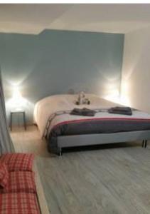 a bedroom with a bed in a room at Coeur d'Alsace 1 in Kaysersberg