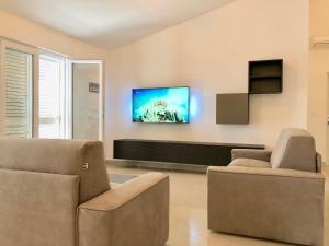 TV a/nebo společenská místnost v ubytování Apartman Gaga