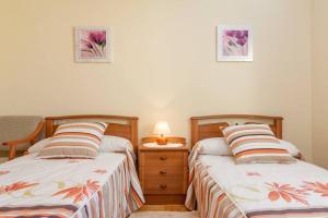A bed or beds in a room at Casa Pauli