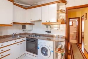 A kitchen or kitchenette at Casa Pauli