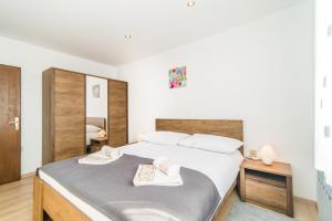 Postel nebo postele na pokoji v ubytování Apartments Dino