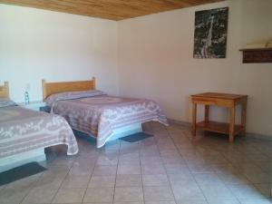 Postel nebo postele na pokoji v ubytování Cabañas Los Portales Barrancas del Cobre