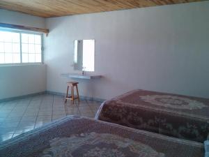 Postel nebo postele na pokoji v ubytování Cabañas Los Portales Barrancas del Cobre