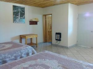 Postel nebo postele na pokoji v ubytování Cabañas Los Portales Barrancas del Cobre