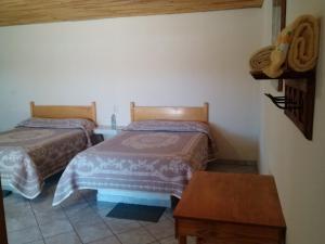 Postel nebo postele na pokoji v ubytování Cabañas Los Portales Barrancas del Cobre