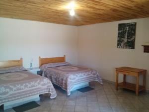 Postel nebo postele na pokoji v ubytování Cabañas Los Portales Barrancas del Cobre