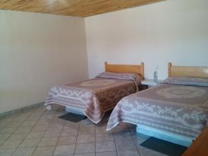 Postel nebo postele na pokoji v ubytování Cabañas Los Portales Barrancas del Cobre