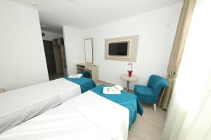 Postel nebo postele na pokoji v ubytování Hotel Delfin