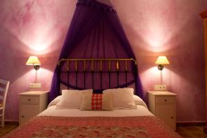 A bed or beds in a room at Hotel Sierra Quilama