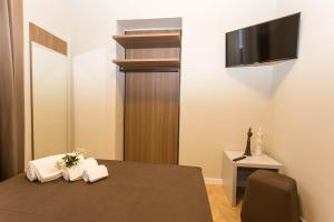 TV a/nebo společenská místnost v ubytování Le Affacciate Bruzie Home Guest House