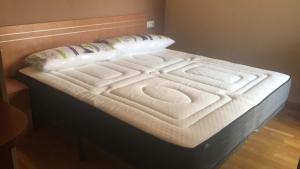 Posteľ alebo postele v izbe v ubytovaní Altavista Apartment