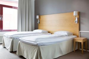 Postel nebo postele na pokoji v ubytování Comfort Hotel Fosna