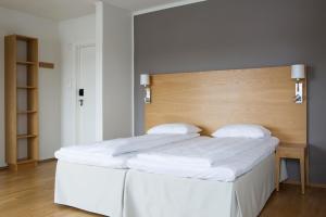 Postel nebo postele na pokoji v ubytování Comfort Hotel Fosna