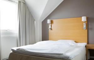 Postel nebo postele na pokoji v ubytování Comfort Hotel Fosna