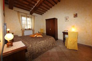 Un pat sau paturi într-o cameră la Agriturismo Bagnaia