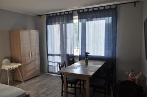 Łóżko lub łóżka w pokoju w obiekcie Apartament Wrzos