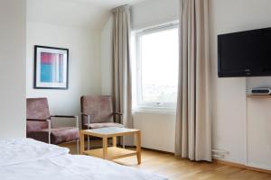 TV a/nebo společenská místnost v ubytování Comfort Hotel Fosna