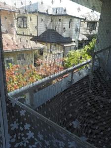 a balcony with a view of a garden at Jukichi Owada Residence in Sendai