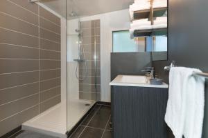 a bathroom with a shower and a sink and a shower at Domaine Spalazen Nature in Palazinges +47 photos