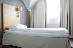 Postel nebo postele na pokoji v ubytování Comfort Hotel Fosna