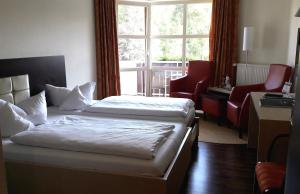 Postel nebo postele na pokoji v ubytování allgäu resort