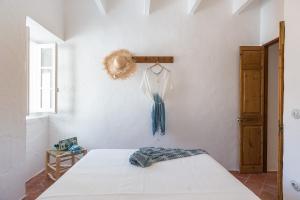 Postel nebo postele na pokoji v ubytování Ses Voltes Sant Antoni