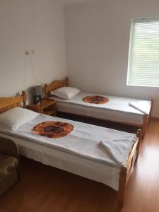 Uma cama ou camas num quarto em Guest House Shotarovi