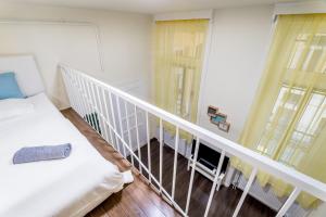 A bed or beds in a room at BpR Turquoise Simplicity Apartment